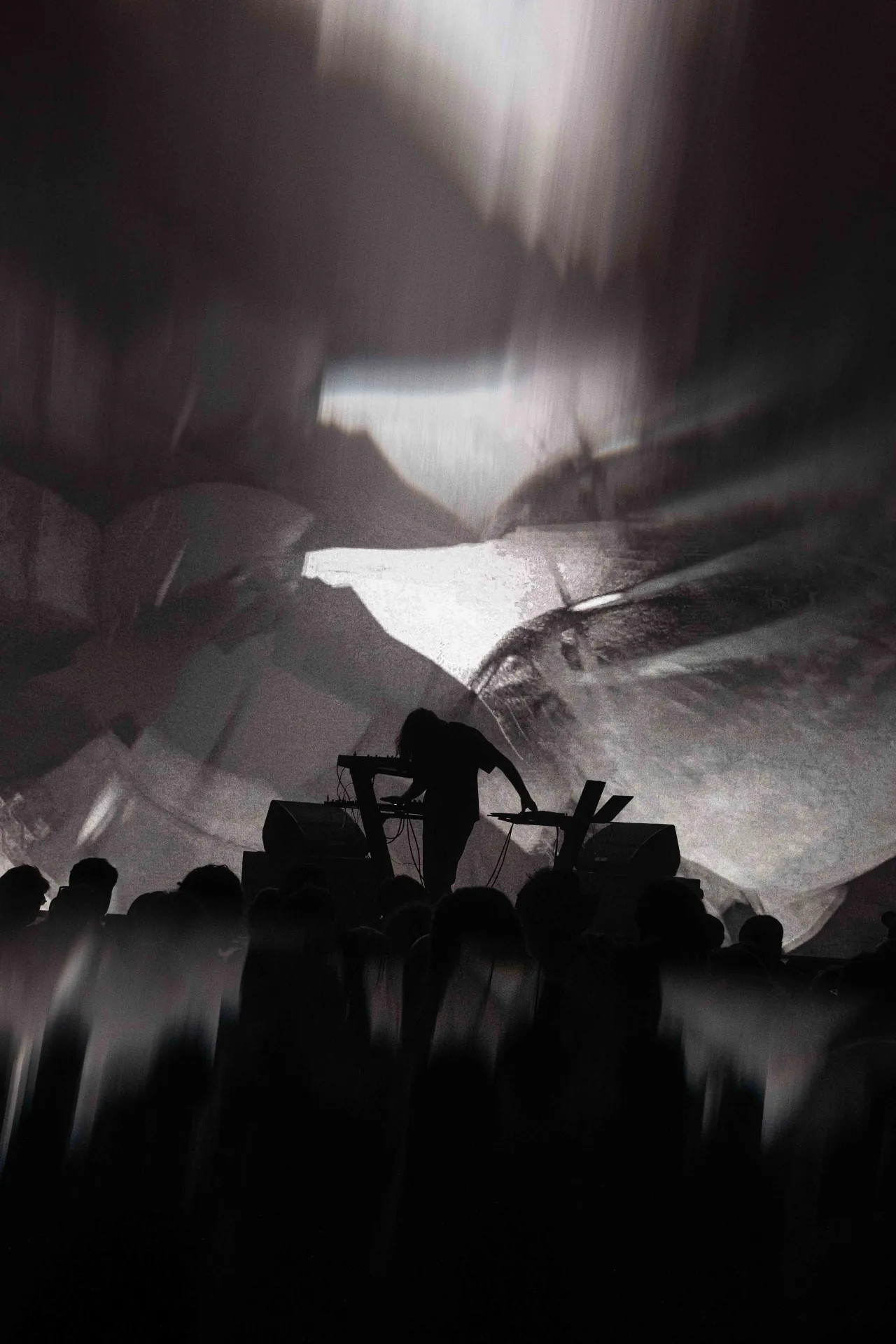 Musicians playing live at a concert, engaging with the audience and delivering an electrifying performance.